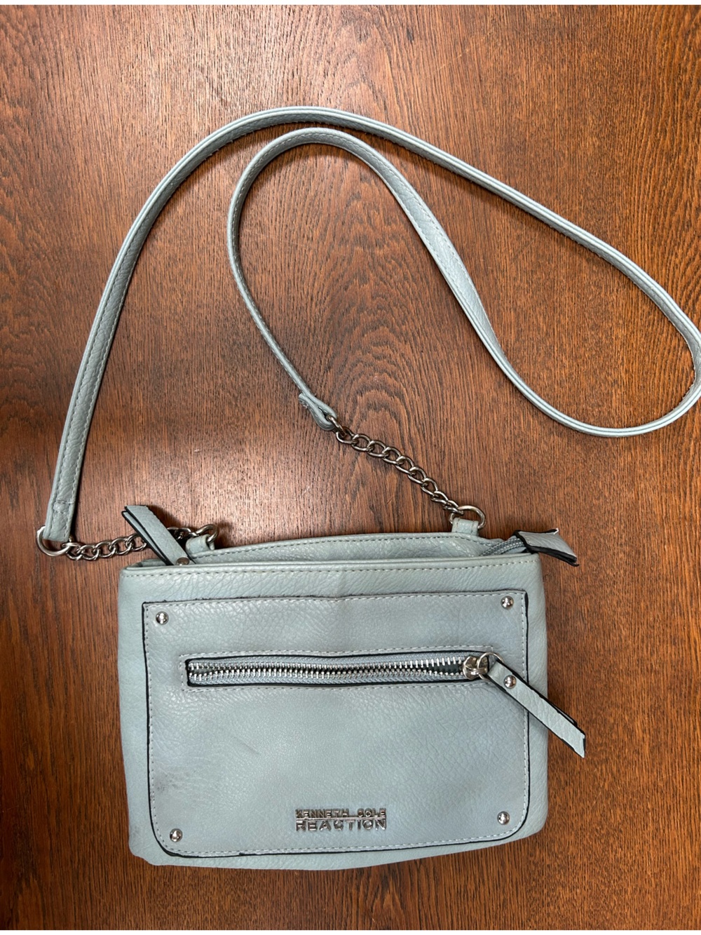 Kenneth Cole Reaction Pale Blue Pebbled Crossbody Bag. 2 main sections+ 1zipper